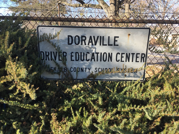 A sign that says, Doraville driver education center.