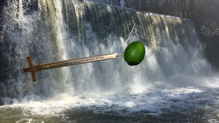 Sword piercing a lime over a waterfall background.